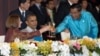 U.S. President Barack Obama watches as Cambodia's Prime Minister Hun Sen, right, and Australian Prime Minister Julia Gillard toast, East Asia Summit Dinner, Phnom Penh, Nov. 19, 2012.