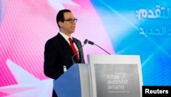 FILE - U.S. Secretary of the Treasury Steven Mnuchin speaks during the Future Investment Initiative conference in Riyadh, Saudi Arabia, Oct. 25, 2017. Mnuchin plans to attend this year's conference despite growing evidence that a Saudi journalist was killed inside the Saudi consulate in Istanbul, Turkey.