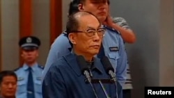 China's former railways minister, Liu Zhijun, attends a trial for charges of corruption and abuse of power at a courthouse in Beijing in this still image taken from video dated June 9, 2013.