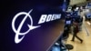 The Boeing logo appears above a trading post on the floor of the New York Stock Exchange before the opening bell, March 11, 2019.