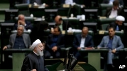 FILE - Iranian President Hassan Rouhani speaks during parliament's open session on a confidence vote for four new ministers, in Tehran, Oct. 27, 2018. 