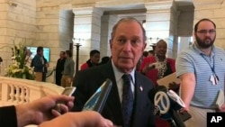 Former New York City Mayor Michael Bloomberg talks to the media after filing paperwork to appear on the ballot in Arkansas' March 3 presidential primary, Nov. 12, 2019 in Little Rock, Ark. 