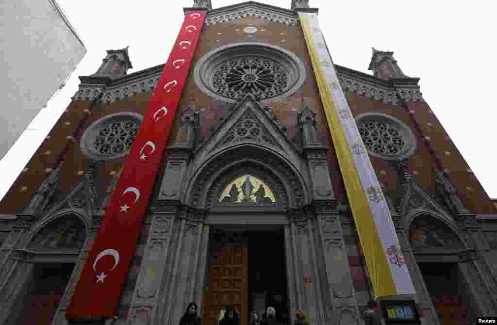 The St. Antuan Catholic church is decorated with Turkish and Vatican flags before the visit of Pope Francis in central Istanbul, Nov. 28, 2014.