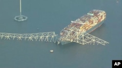 বাল্টিমোর শহরের পাটাপস্কো নদীতে বিধ্বস্ত ব্রিজ। ফটোঃ ২৬ মার্চ, ২০২৪। 