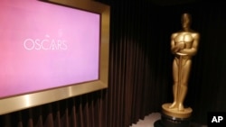 FILE - A giant Oscar statue is seen at The Oscars Greenroom in Los Angeles, California, Feb. 22, 2017.