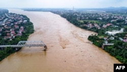 This aerial picture shows the collapsed Phong Chau bridge over the Red River in Phu Tho province on Sept. 9, 2024, after Typhoon Yagi hit northern Vietnam.