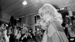 FILE - Italian actress Monica Vitti arrives at the Festival Palace to see director Michelangelo Antonioni's film "Identificazione di una Donna" in Cannes, France, May 23, 1982.