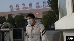A man leaves the Wuhan Medical Treatment Centre, where a man who died from a respiratory illness was confined, in the city of Wuhan, Hubei province.