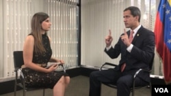 Venezuelan opposition leader Juan Guaido (R) is interviewed by VOA Spanish reporter Adriana Nunez Rabascal, in Caracas, Venezuela, Aug. 19, 2019.