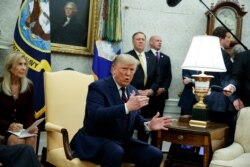 President Donald Trump speaks during a meeting with Italian President Sergio Mattarella in the Oval Office of the White House, Oct. 16, 2019, in Washington.