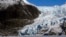 FILE - People walk near the Mendenhall Glacier on Feb. 9, 2025, in Juneau, Alaska. 