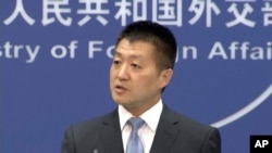 FILE - Lu Kang, spokesman of the Chinese Ministry of Foreign Affairs, speaks to reporters about the international tribunal's ruling on the South China Sea during a news briefing in Beijing, July 12, 2016.