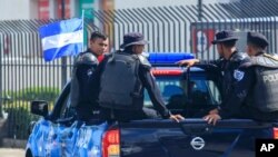 FILE - A Nicaraguan National Police pickup truck patrols in downtown Managua, Nicaragua, Aug. 24, 2019.