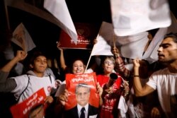 Supporters of Tunisian presidential candidate Nabil Karoui celebrate after he was freed, days before Sunday's second-round runoff election in Tunis, Tunisia, Oct. 9, 2019.