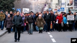 Demonstrators march during a pro Russia rally in Donetsk, Ukraine, March 11, 2014