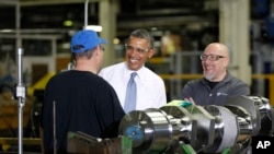 President Barack Obama speaks with employees Calvin Anderson, left, and Theodore (Ted) Korber at GE Energy in Waukesha, Wisconsin, Jan. 30, 2014. 