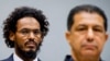 Ahmad Al Mahdi Al Faqi, left, enters the court room for his initial appearance at the International Criminal Court in The Hague, Netherlands, Sept. 30, 2015. 