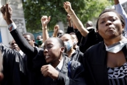 Lawyers chant slogans as they march to demand justice after the killing, on August 28, of the lawyer and President of the Bar of Lawyers of Port-au-Prince Monferrier Dorval.