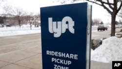 FILE - A sign for the ride-sharing service Lyft is pictured. Lyft Inc. was one of several companies on Sept. 3, 2021, that criticized new Texas laws on abortion, handguns and voting limitations.