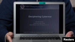 French urban climber, Alain Robert, also known as "French Spiderman", right, scales the 145 meters of the Agbar tower with the La Sagrada Familia Basilica designed by architect Antoni Gaudi in the background.