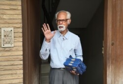 FILE - In this Nov. 8, 2020, photo, Vice President Kamala Harris' maternal uncle, Balachandran Gopalan, talks to media outside his house, in New Delhi, India.