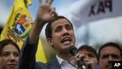 Venezuela's self-declared interim leader Juan Guaido speaks to supporters in a public plaza in Las Mercedes neighborhood of Caracas, Venezuela, Jan. 26, 2019.