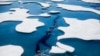 FILE - Sea ice breaks apart at the Northwest Passage, in the Canadian Arctic Archipelago, July 21, 2017.