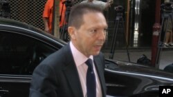 Greece's finance minister Yannis Stournaras arrives for a meeting between Greek officials and the debt inspectors in Athens, July 26, 2012