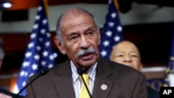 FILE - Rep. John Conyers, D-Mich., flanked by other top Democrats, speaks at a news conference on Capitol Hill in Washington. 