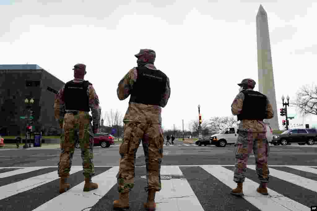 Members of the DC National Guard provide traffic control at an intersection near a rally at Freedom Plaza, Jan. 5, 2021.