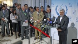 Iran's International Atomic Energy Agency ambassador Ali Asghar Soltanieh (R) briefs the media during a board of governors meeting at the United Nations headquarters in Vienna, Austria, March 8, 2012.
