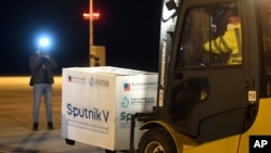 FILE - A shipment of Russia's Sputnik COVID-19 vaccine arrives at Kosice Airport, Slovakia, March 1, 2021.