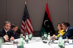 U.S. Secretary of State Antony Blinken, left, speaks as he meets with Libyan Prime Minister Abdulhamid Dbeibeh, right, at the Berlin Marriott Hotel in Berlin, Germany, June 24, 2021.