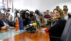 FILE - Public prosecutor Katica Janeva, right, takes an oath in Skopje, Macedonia, Sept. 16, 2015.