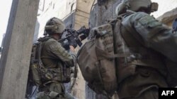 This handout picture released by the Israeli army on Jan. 22, 2024, shows Israeli soldiers operating in the Gaza Strip. (Photo by Israeli Army/AFP)