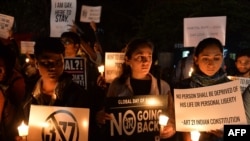 Indian LGBT activists hold placards as they demonstrate against the Supreme Court's reinstatement of Section 377, which bans gay sex in a law dating from India's colonial era, in Bangalore, Jan. 28, 2014.