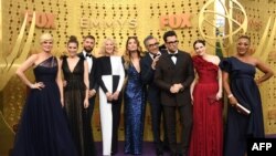 FILE - In this photo taken on Sept. 22, 2019, 'Schitt's Creek' cast members arrive for the 71st Emmy Awards at the Microsoft Theatre in Los Angeles. This year, the awards were virtual and the show won big, winning in seven categories.