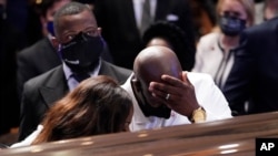 Philonise Floyd, brother, of George Floyd pauses at the casket during a funeral service for Floyd at The Fountain of Praise church, June 9, 2020, in Houston.