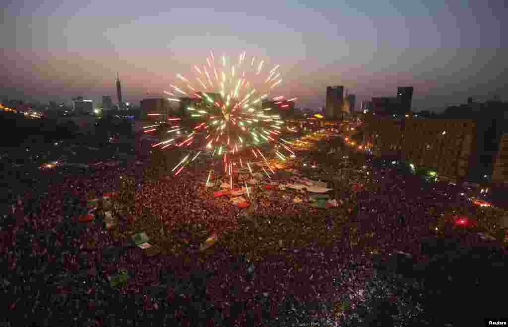Fireworks explode as supporters of Muslim Brotherhood's presidential candidate Mohamed Morsi celebrate his victory in the election at Tahrir Square in Cairo, June 24, 2012. (Reuters)