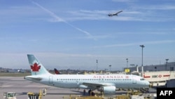 An Air Canada plane sits on the tarmac at Trudeau airport near Montreal, Canada. 