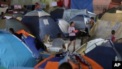 FILE - Tents fill the Tancredo Neves Gymnasium that is operating as a shelter for Venezuelans in Boa Vista, Roraima state, Brazil, March 8, 2018.