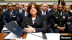 FILE - U.S. Secret Service Director Julia Pierson takes her seat to testify at the House Oversight and Government Reform Committee hearing on "White House Perimeter Breach: New Concerns about the Secret Service" on Capitol Hill, Sept. 30, 2014. 