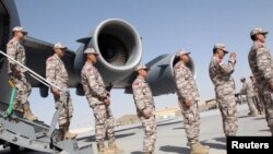 FILE - Turkish troops arrive at their military base in Doha, Qatar, June 23, 2017. Closure of the base is one of the demands being made on Qatar by four Arab nations.