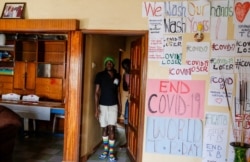 Gay Ugandan refugee Chris Wasswa walks in the house that serves as a shelter for him and other LGBT refugees in Nairobi, Kenya, June 11. 2020.