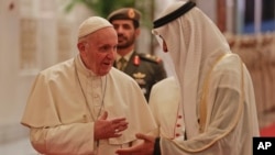 Pope Francis is welcomed by Abu Dhabi's Crown Prince Sheikh Mohammed bin Zayed Al Nahyan, upon his arrival at the Abu Dhabi airport, United Arab Emirates, Feb. 3, 2019.