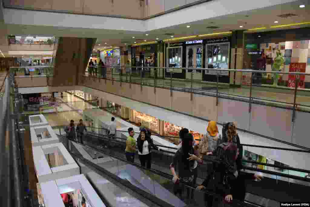 Modern shopping malls in Irbil are as important in daily life as the traditional and old shopping centers. International brands can be found for sale in the malls, and they have become meeting places for people trying to escape the hot weather in Iraq.
