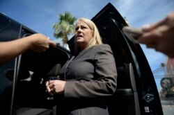 FILE - Puerto Rico Justice Secretary Wanda Vazquez answers reporters' questions, in San Juan, Puerto Rico, Jan. 16, 2018.