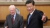 FILE - Then-leader of China's Communist Party of China Xi Jinping, right, gestures to former U.S. President Jimmy Carter during their meeting at the Zhongnanhai, the central government compound in Beijing, China, Dec. 13, 2012. (China Daily via Reuters)