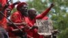 Members of the Economic Freedom Fighters protest outside the Constitutional Court in Johannesburg, Tuesday, Feb. 9, 2016.