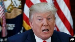 President Donald Trump speaks during a meeting with business leaders in the State Department Library in the White House complex in Washington, April 11, 2017.
